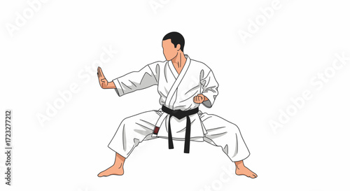 Karateka demonstrating a powerful stance with focused concentration pose