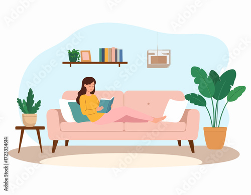 A woman relaxes on a pink couch in a cozy living room, reading a book with plants and decorations around.