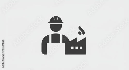 Industrial worker silhouette by factory with smoke, symbolizing manufacturing and labor.
