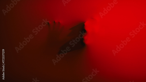Photos zombie face behind the red fabric