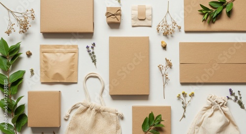 Creative Flat Lay Arrangement of Brown Packaging and Greenery