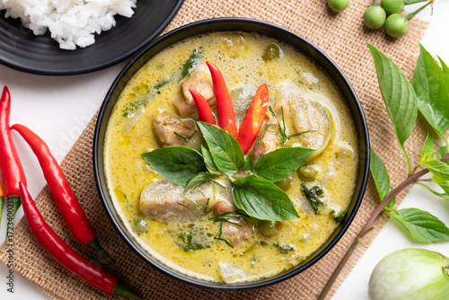 Top view of Thai green curry chicken with rice and ingredients