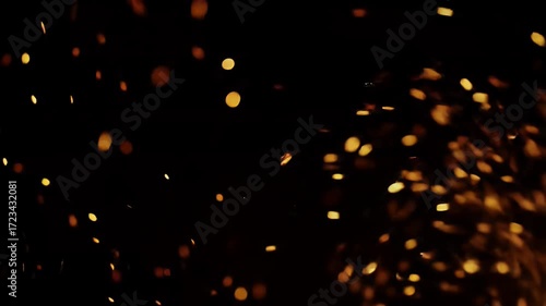 Golden Embers Streaming Against Black Background