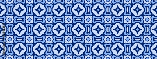 A symmetrical repeating geometric pattern with a mid-century modern abstract feel in varying shades of blue.