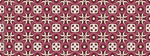 A geometric pattern featuring floral motifs and diamond shapes in maroon and cream colors.