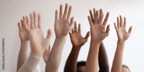 Diverse group raising hands volunteering together participation