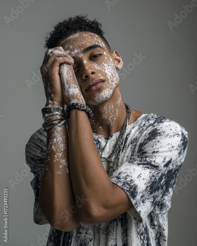 Elegance in Thought: A thoughtful person with an artistic flair, poses with closed eyes, hands gracefully near their face, covered partially in a unique material, emanating artistic passion. 