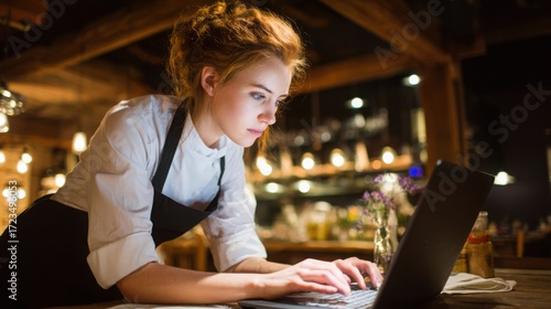establishment. Small business owner focused on work at restaurant table with blurred background. pitch deck slides, case study pages, designed for brand storytelling and e-commerce strategy.