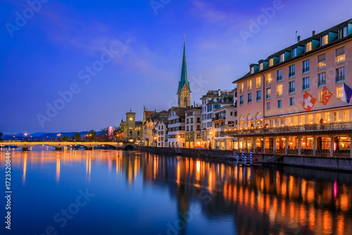 Photography Cityscape with the iconic Fraumunster church and classic buildings on the banks