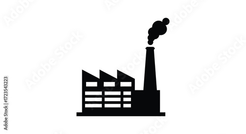 Industrial factory building with a smoking chimney a stark black silhouette
