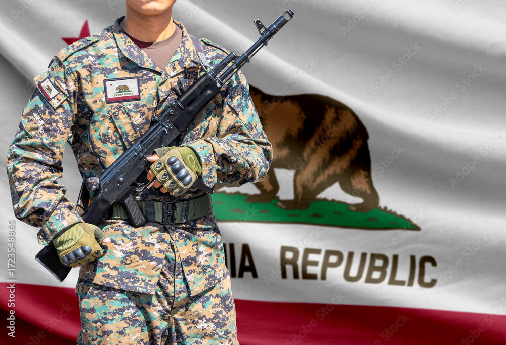 Fototapeta premium California US state flag with soldier holding assault rifle