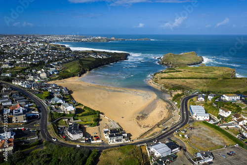 Surf and waves Mawgan Porth north Cornwall England near Newquay and south of Porthcothan and Treyarnon on a summer day with blue sk
