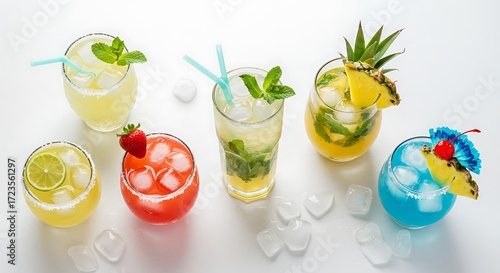 Colorful Tropical Cocktails with Fruit Garnishes and Ice on White Surface