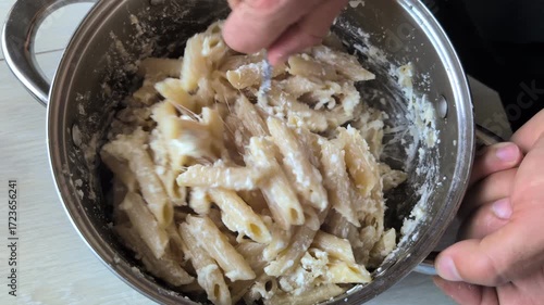 Preparing Creamy Pasta with a Rich Sauce in a Convenient Pot for a Delicious Meal