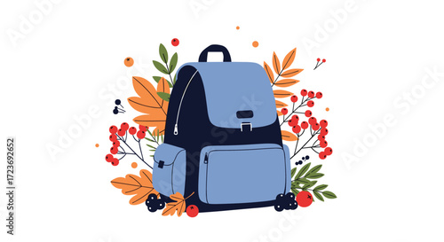 A blue backpack is surrounded by autumn leaves and berries symbolizing the start of the school year.