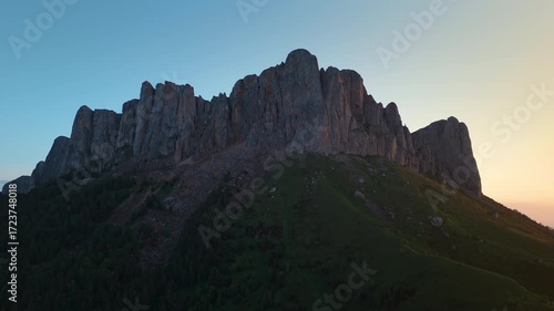 Amazing rock mountain with evening or sunrise sunlight. Drone panoramic view
