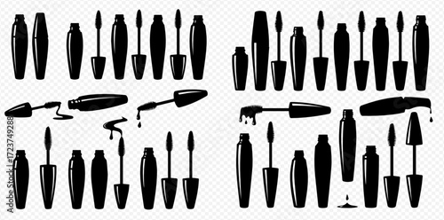 Collection of black mascara tubes and applicators in various shapes and arrangements, some with product smears.