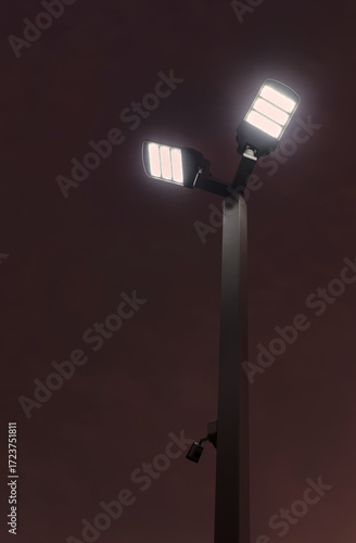 Double luminaire LED street light in the dusk