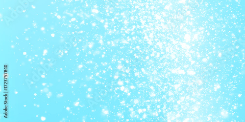 winter morning concept Blue glitter light snowfall texture background, Snow falls on winter blue sky with various snows are dancing on the blue background in unique style.