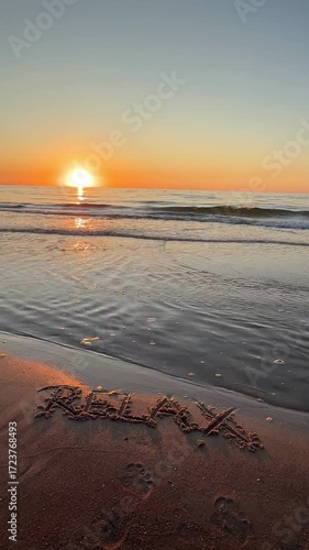 Golden sunset over a tranquil beach, where 