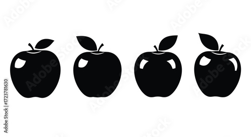 Four glossy black apples with leaves arranged in a row against a white surface vector