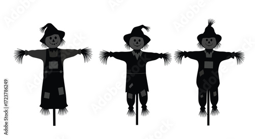 Three silhouetted scarecrows standing guard in harvest season celebration fun vector