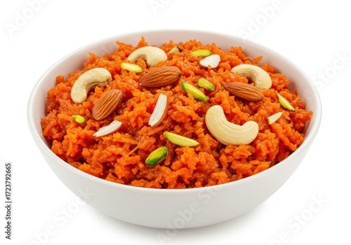 Gajar ka halwa indian sweet with carrots, nuts and pistachios in white bowl