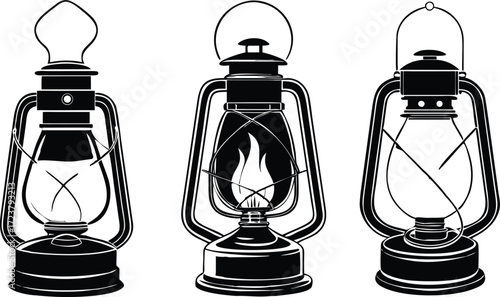 silhouettes Three vintage kerosene lanterns in a row one lit.