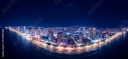 Fényképezés Aerial view Panorama of night cityscape with skyscraper neon light Nha Trang city Vietnam and bay of Sea
