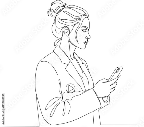 Young businesswoman using smartphone and looking thoughtful indoors  