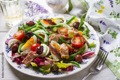 Mediterranean Tuna Salad. Nicoise Salad. White wooden background