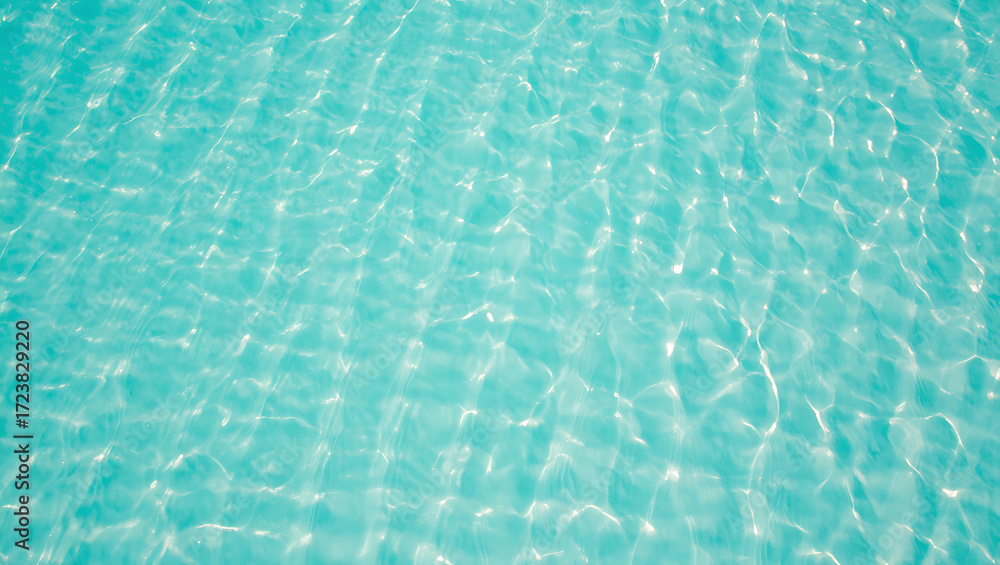 Obraz premium Rippling turquoise water surface with sunlight reflections