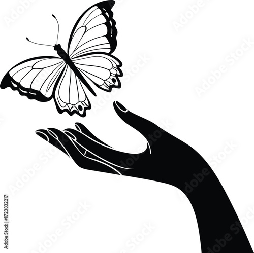 Delicate hand gently holding a beautiful butterfly silhouette graphic