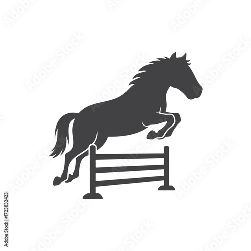 Horse is jumping over a hurdle fence silhouette, the horse is in midair, poised for the jump.