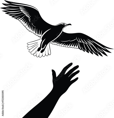 Silhouette of a hand reaching out with a bird flying above it