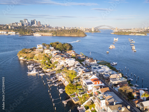 Sydney, Australia: Aerial view of the Birchgrove affluent suburb with the Sydney skyline and harbor bridge in Australia