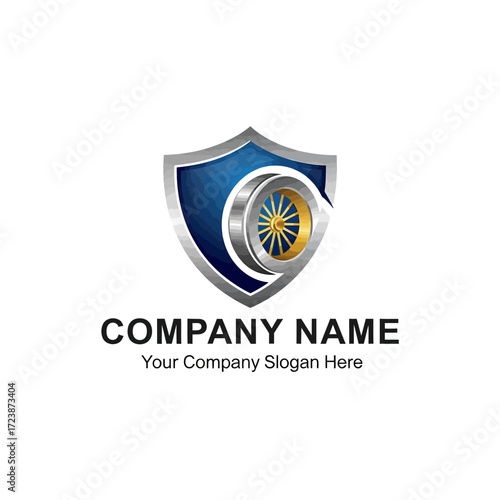 A corporate logo template featuring a blue shield with a silver border, enclosing a metallic wheel or turbine emblem.