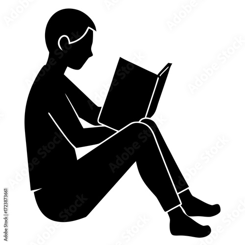 silhouette of a man reading a book