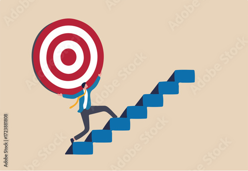 Effort and ambition to reach goal or target, challenge to win higher target, business mission or career concept, strong businessman carry big target on his shoulder walking up the stairs.