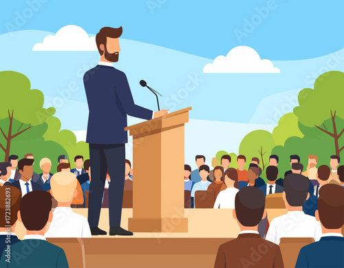 A confident man with a beard, standing at a podium and waving to a large audience in an outdoor setting, representing public speaking, political events, or a business conference.