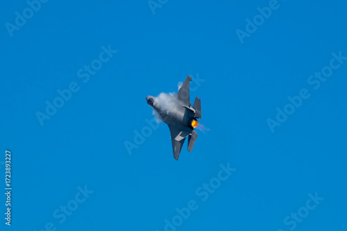 vapor mist rolling off of jet while it hits afterburners