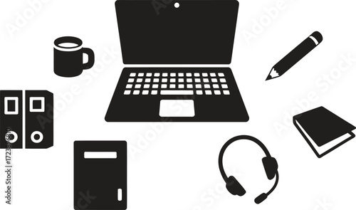 Collection of office and study supplies arranged around a laptop