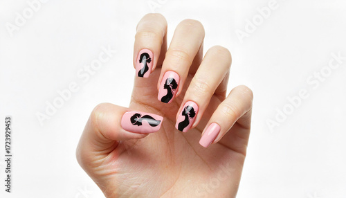 Stylish woman hand with pink and black nail art design  