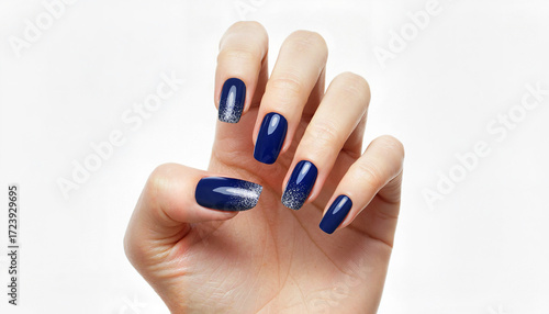Elegant blue ombre manicure displayed on hand against white background  