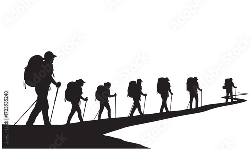 Group of Silhouetted Hikers Walking Uphill on an Outdoor Trail
