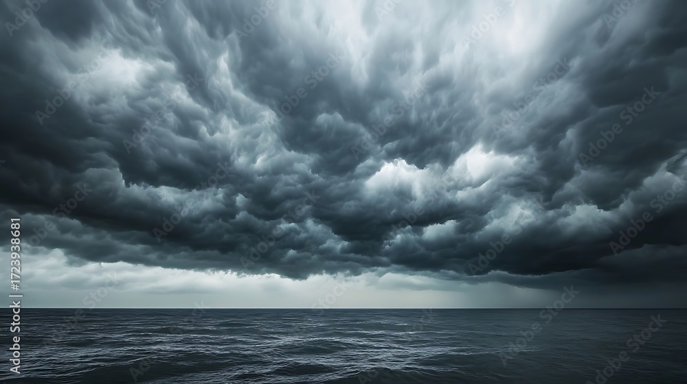 Fototapeta premium Dramatic storm clouds over turbulent ocean waves powerful nature photography