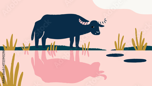 A dark blue buffalo stands in shallow water, casting a pink reflection on the surface, surrounded by dry grass and a pale pink sky