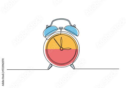 An alarm clock with half of its face colored yellow and the other half colored red.