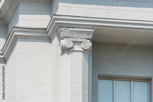 Photography Angled view of a classical, beige stoneplaster building in a European city with