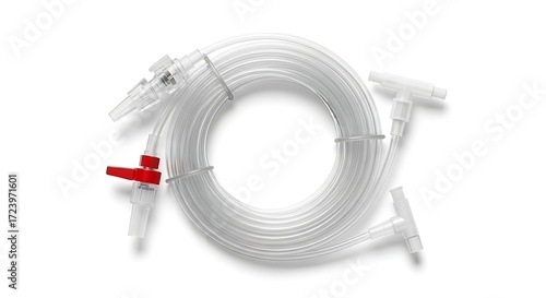 Clear plastic tubing with connectors and a red valve, coiled on a white background.